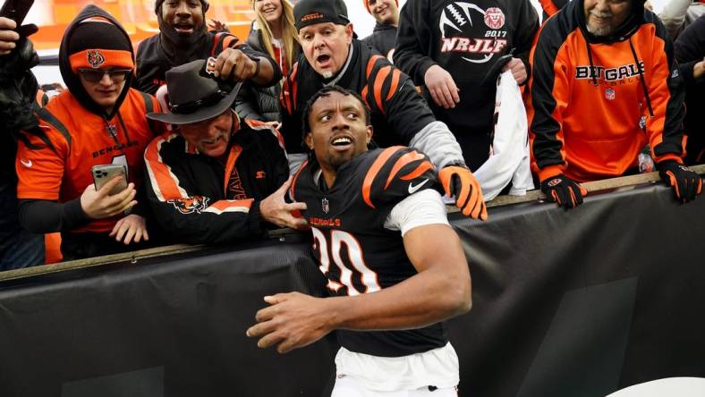 Dec 11, 2022; Cincinnati, Ohio, USA; Cincinnati Bengals cornerback Eli Apple (20) leaps into the stands with the fans at the conclusion of a Week 14 NFL game against the Cleveland Browns, Sunday, Dec. 11, 2022, at Paycor Stadium in Cincinnati. The Cincinnati Bengals won, 23-10.  Mandatory Credit: Kareem Elgazzar-USA TODAY Sports