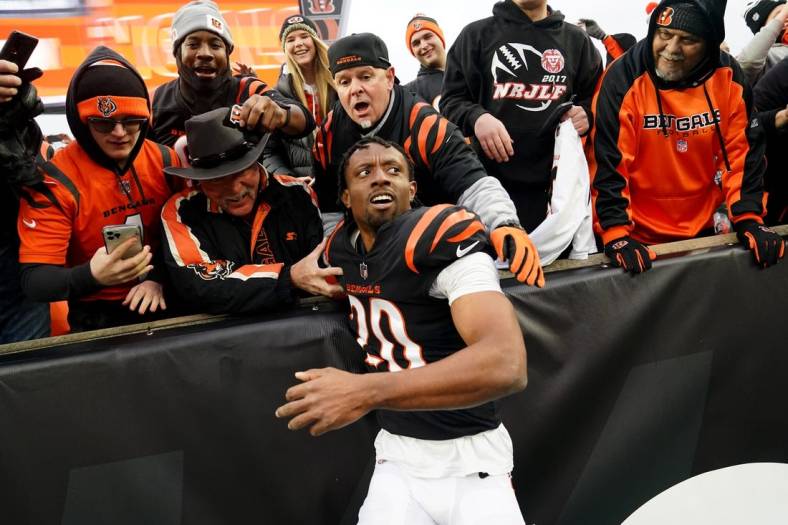 Dec 11, 2022; Cincinnati, Ohio, USA; Cincinnati Bengals cornerback Eli Apple (20) leaps into the stands with the fans at the conclusion of a Week 14 NFL game against the Cleveland Browns, Sunday, Dec. 11, 2022, at Paycor Stadium in Cincinnati. The Cincinnati Bengals won, 23-10.  Mandatory Credit: Kareem Elgazzar-USA TODAY Sports
