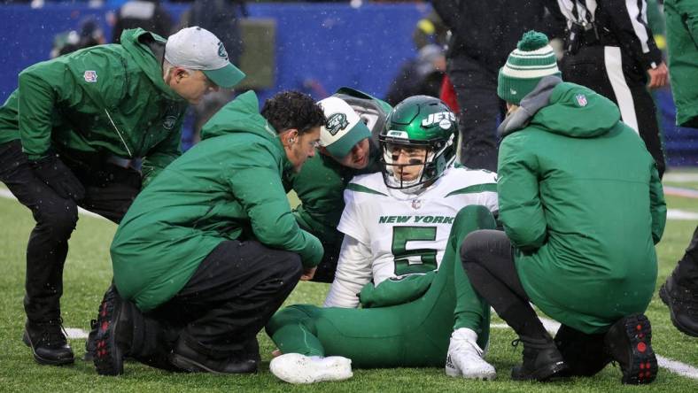 Jets quarterback Mike White left the game several times after being hit by the Bills defense.  He was able to come back and finish the game.