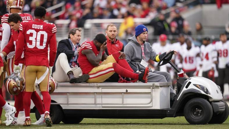 Dec 11, 2022; Santa Clara, California, USA; San Francisco 49ers wide receiver Deebo Samuel (19) is taken off the field after suffering an injury against the Tampa Bay Buccaneers in the second quarter at Levi's Stadium. Mandatory Credit: Cary Edmondson-USA TODAY Sports