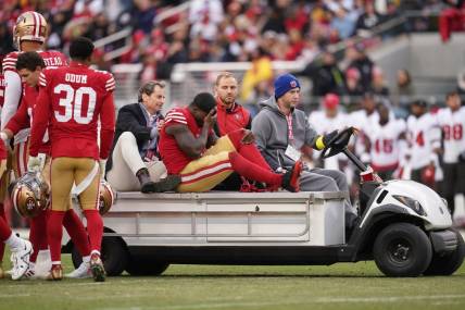 Dec 11, 2022; Santa Clara, California, USA; San Francisco 49ers wide receiver Deebo Samuel (19) is taken off the field after suffering an injury against the Tampa Bay Buccaneers in the second quarter at Levi's Stadium. Mandatory Credit: Cary Edmondson-USA TODAY Sports