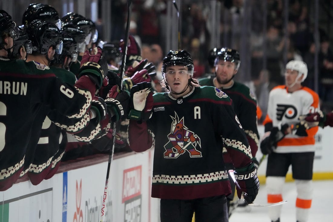 Dec 11, 2022; Tempe, Arizona, USA; Arizona Coyotes right wing Clayton Keller (9) celebrates his goal against the Philadelphia Flyers during the first period at Mullett Arena. Mandatory Credit: Joe Camporeale-USA TODAY Sports