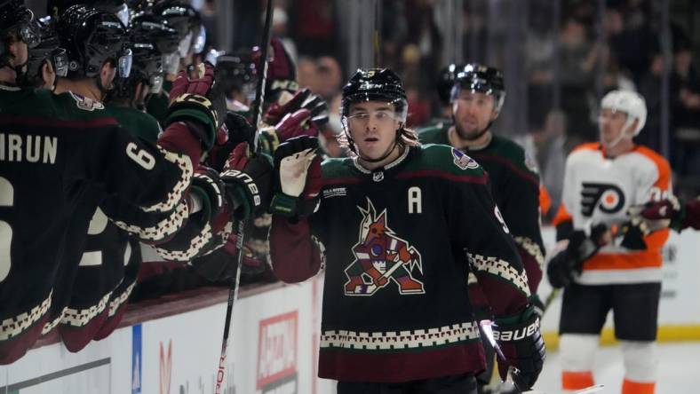 Dec 11, 2022; Tempe, Arizona, USA; Arizona Coyotes right wing Clayton Keller (9) celebrates his goal against the Philadelphia Flyers during the first period at Mullett Arena. Mandatory Credit: Joe Camporeale-USA TODAY Sports