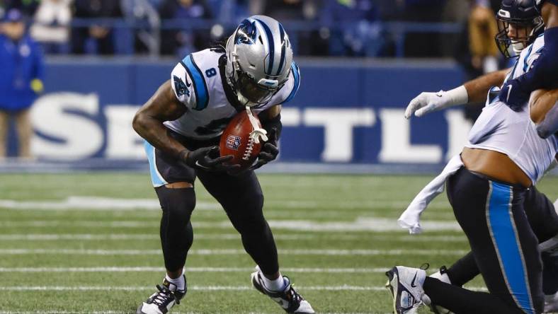 Dec 11, 2022; Seattle, Washington, USA; Carolina Panthers cornerback Jaycee Horn (8) recovers an onside kick against the Seattle Seahawks during the fourth quarter at Lumen Field. Mandatory Credit: Joe Nicholson-USA TODAY Sports