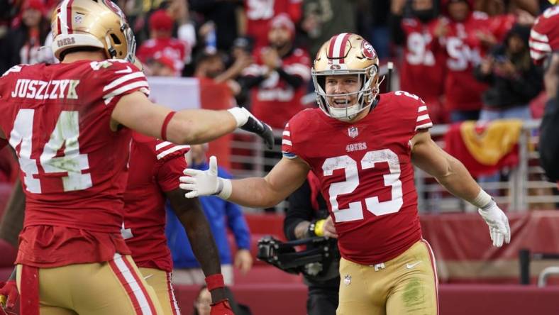 Dec 11, 2022; Santa Clara, California, USA; San Francisco 49ers running back Christian McCaffrey (23) is congratulated by fullback Kyle Juszczyk (44) after scoring a touchdown against the Tampa Bay Buccaneers in the third quarter at Levi's Stadium. Mandatory Credit: Cary Edmondson-USA TODAY Sports