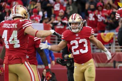 Dec 11, 2022; Santa Clara, California, USA; San Francisco 49ers running back Christian McCaffrey (23) is congratulated by fullback Kyle Juszczyk (44) after scoring a touchdown against the Tampa Bay Buccaneers in the third quarter at Levi's Stadium. Mandatory Credit: Cary Edmondson-USA TODAY Sports