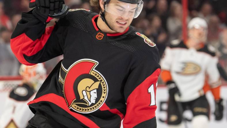 Dec 12, 2022; Ottawa, Ontario, CAN; Ottawa Senators right wing Alex DeBrincat (12) celebrates his goal scored in the first period against the Anaheim Ducks at the Canadian Tire Centre. Mandatory Credit: Marc DesRosiers-USA TODAY Sports