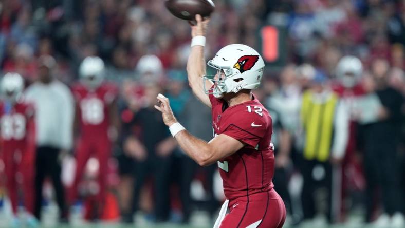 Dec 12, 2022; Glendale, Arizona, USA; Arizona Cardinals quarterback Colt McCoy (12) throws a pass against the New England Patriots during the first half at State Farm Stadium. Mandatory Credit: Joe Camporeale-USA TODAY Sports