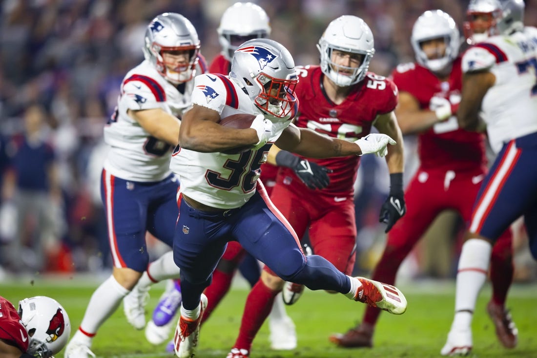 Dec 12, 2022; Glendale, Arizona, USA; New England Patriots running back Kevin Harris (36) scores a touchdown against the Arizona Cardinals in the first half at State Farm Stadium. Mandatory Credit: Mark J. Rebilas-USA TODAY Sports