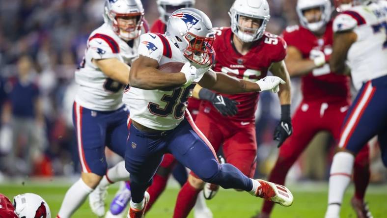 Dec 12, 2022; Glendale, Arizona, USA; New England Patriots running back Kevin Harris (36) scores a touchdown against the Arizona Cardinals in the first half at State Farm Stadium. Mandatory Credit: Mark J. Rebilas-USA TODAY Sports