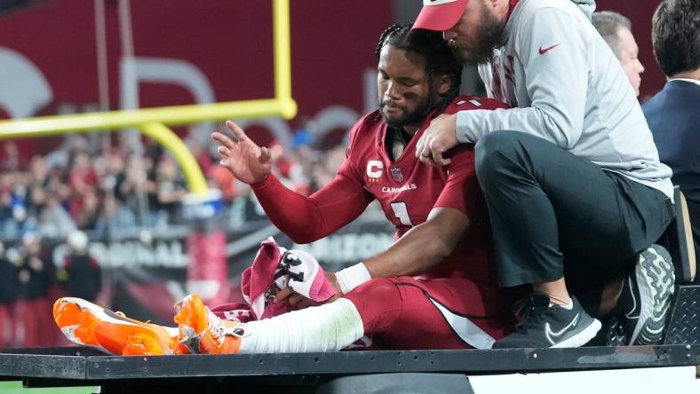 Dec 12, 2022; Glendale, Ariz., USA;  Arizona Cardinals quarterback Kyler Murray (1) waves as he   s carted off the field after an injury against the New England Patriots during the first quarter at State Farm Stadium. Mandatory Credit: Michael Chow-Arizona Republic

Nfl Cardinals Patriots 1213 New England Patriots At Arizona Cardinals