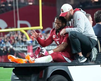 Dec 12, 2022; Glendale, Ariz., USA;  Arizona Cardinals quarterback Kyler Murray (1) waves as he   s carted off the field after an injury against the New England Patriots during the first quarter at State Farm Stadium. Mandatory Credit: Michael Chow-Arizona Republic

Nfl Cardinals Patriots 1213 New England Patriots At Arizona Cardinals