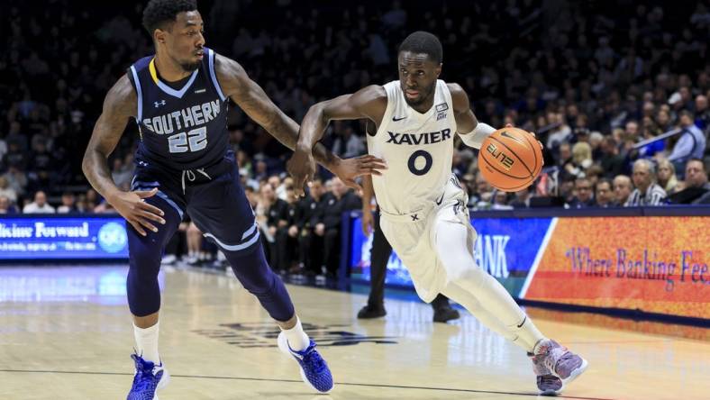 Dec 13, 2022; Cincinnati, Ohio, USA;  Southern University Jaguars guard Brion Whitley (22) defends as Xavier Musketeers guard Souley Boum (0) controls the ball in the first half at the Cintas Center. Mandatory Credit: Aaron Doster-USA TODAY Sports