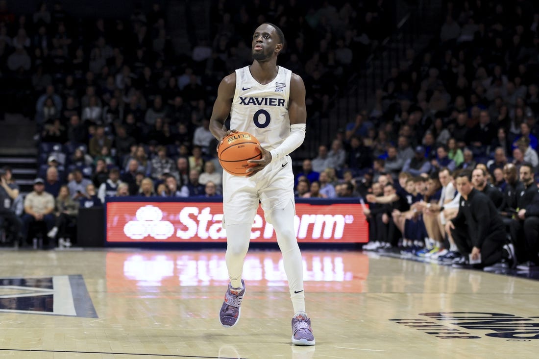 Dec 13, 2022; Cincinnati, Ohio, USA;  Xavier Musketeers guard Souley Boum (0) attempts a three-point basket against the Southern University Jaguars in the first half at the Cintas Center. Mandatory Credit: Aaron Doster-USA TODAY Sports