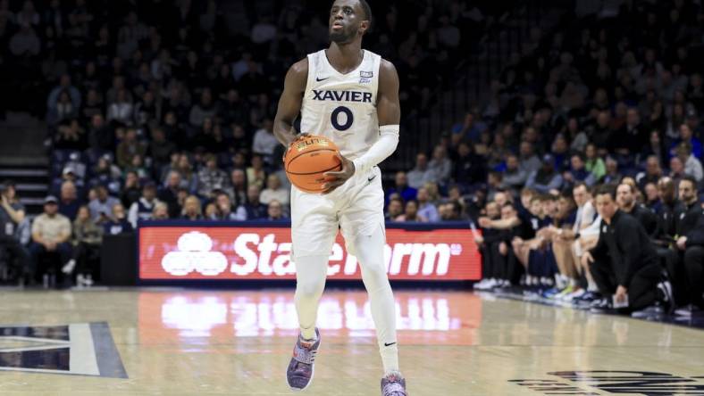 Dec 13, 2022; Cincinnati, Ohio, USA;  Xavier Musketeers guard Souley Boum (0) attempts a three-point basket against the Southern University Jaguars in the first half at the Cintas Center. Mandatory Credit: Aaron Doster-USA TODAY Sports