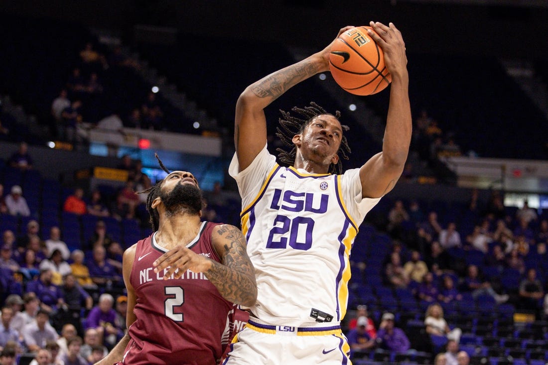 Dec 13, 2022; Baton Rouge, Louisiana, USA; LSU Tigers forward Derek Fountain (20) grabs a rebound against North Carolina Central Eagles forward Kris Monroe (2) during the first half at Pete Maravich Assembly Center. Mandatory Credit: Stephen Lew-USA TODAY Sports