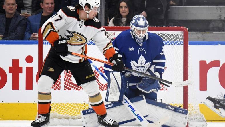 Dec 13, 2022; Toronto, Ontario, CAN;  Toronto Maple Leafs goalie Ilya Samsonov (35) stops a shot as Anaheim Ducks forward Frank Valtrano (77) tries to deflect the puck in the first period at Scotiabank Arena. Mandatory Credit: Dan Hamilton-USA TODAY Sports