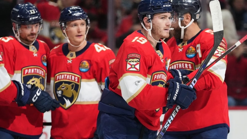 Dec 13, 2022; Sunrise, Florida, USA; Florida Panthers left wing Matthew Tkachuk (19) celebrates his goal against the Columbus Blue Jackets with teammates on the ice during the second period at FLA Live Arena. Mandatory Credit: Jasen Vinlove-USA TODAY Sports