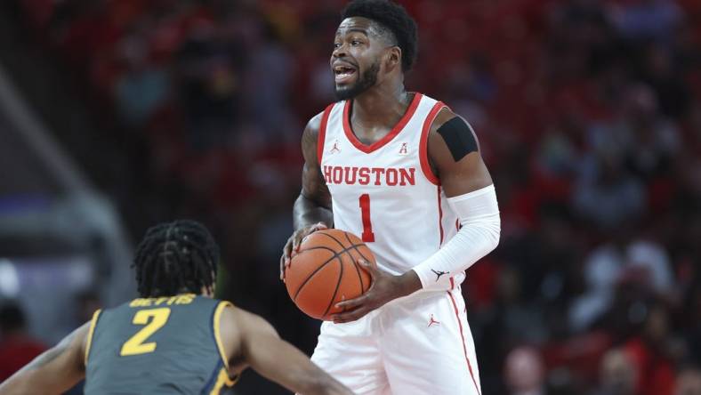 Dec 13, 2022; Houston, Texas, USA; Houston Cougars guard Jamal Shead (1) controls the ball during the first half against the North Carolina A&T Aggies at Fertitta Center. Mandatory Credit: Troy Taormina-USA TODAY Sports