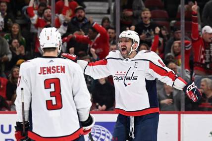 Dec 13, 2022; Chicago, Illinois, USA; Washington Capitals forward Alex Ovechkin (8) celebrates after scoring his 800th career NHL goal and third goal of the game against the Chicago Blackhawks at United Center. Mandatory Credit: Jamie Sabau-USA TODAY Sports