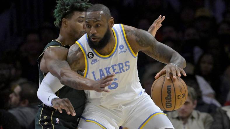 Dec 13, 2022; Los Angeles, California, USA;  Los Angeles Lakers forward LeBron James (6) is defended by Boston Celtics guard Marcus Smart (36) in the first half at Crypto.com Arena. Mandatory Credit: Jayne Kamin-Oncea-USA TODAY Sports