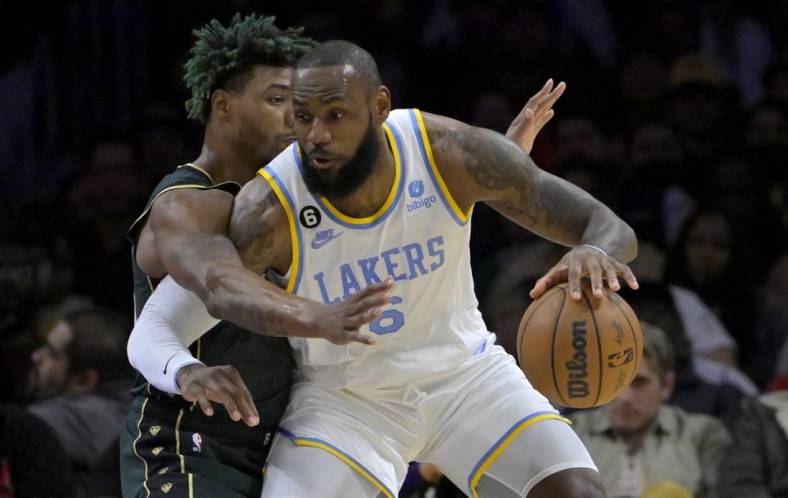 Dec 13, 2022; Los Angeles, California, USA;  Los Angeles Lakers forward LeBron James (6) is defended by Boston Celtics guard Marcus Smart (36) in the first half at Crypto.com Arena. Mandatory Credit: Jayne Kamin-Oncea-USA TODAY Sports