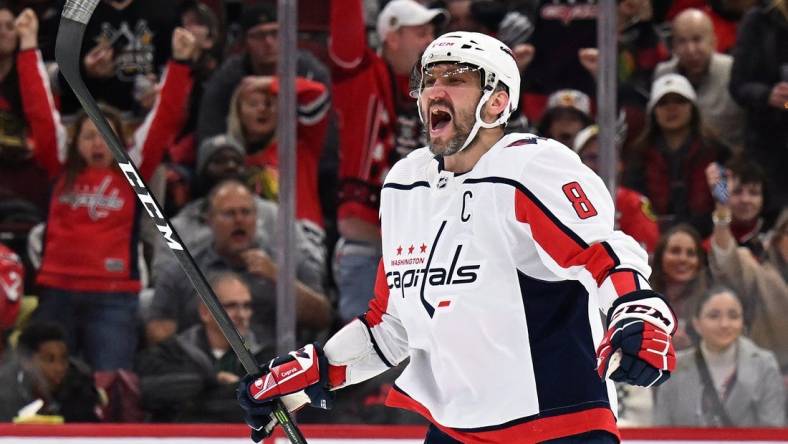 Dec 13, 2022; Chicago, Illinois, USA; Washington Capitals forward Alex Ovechkin (8) celebrates after scoring his 800th career NHL goal and third goal of the game against the Chicago Blackhawks at United Center. Mandatory Credit: Jamie Sabau-USA TODAY Sports