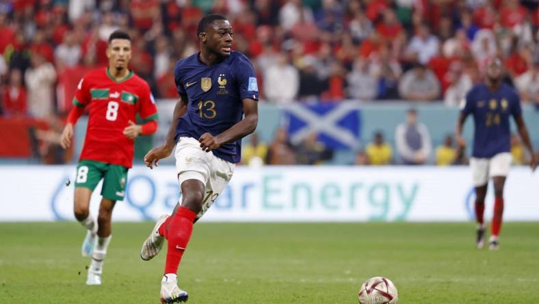 Dec 14, 2022; Al Khor, Qatar; France midfielder Youssouf Fofana (13) dribbles the ball against Morocco during the second half of a semifinal match during the 2022 World Cup at Al Bayt Stadium. Mandatory Credit: Yukihito Taguchi-USA TODAY Sports