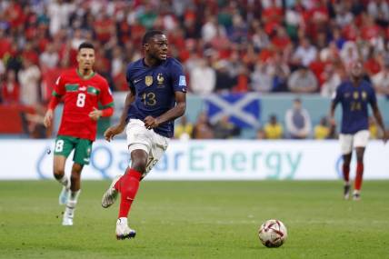 Dec 14, 2022; Al Khor, Qatar; France midfielder Youssouf Fofana (13) dribbles the ball against Morocco during the second half of a semifinal match during the 2022 World Cup at Al Bayt Stadium. Mandatory Credit: Yukihito Taguchi-USA TODAY Sports