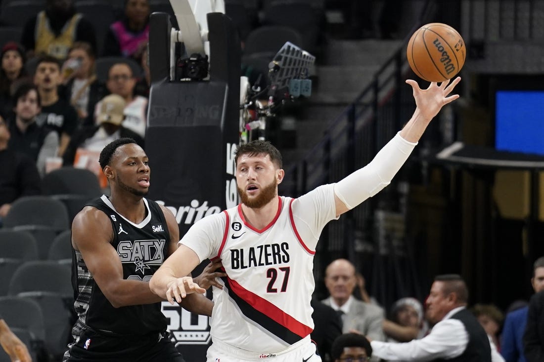 Dec 14, 2022; San Antonio, Texas, USA; Portland Trailblazers center Jusuf Nurkic (27) catches a pass while defended by during the first half against the San Antonio Spurs center Charles Bassey (23) during the first half at AT&T Center. Mandatory Credit: Scott Wachter-USA TODAY Sports