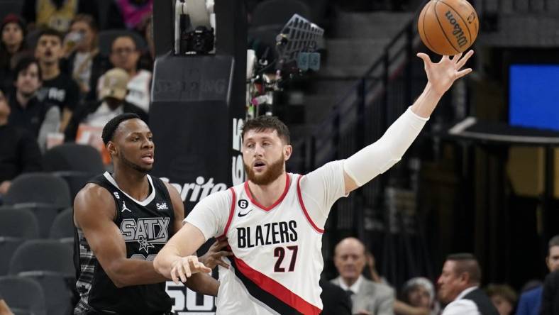 Dec 14, 2022; San Antonio, Texas, USA; Portland Trailblazers center Jusuf Nurkic (27) catches a pass while defended by during the first half against the San Antonio Spurs center Charles Bassey (23) during the first half at AT&T Center. Mandatory Credit: Scott Wachter-USA TODAY Sports