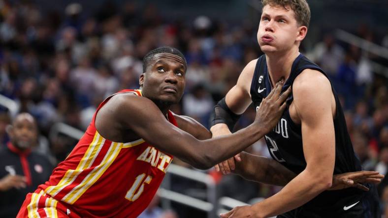 Dec 14, 2022; Orlando, Florida, USA;  Atlanta Hawks center Clint Capela (15) boxes out Orlando Magic center Moritz Wagner (21) in the fourth quarter at Amway Center. Mandatory Credit: Nathan Ray Seebeck-USA TODAY Sports