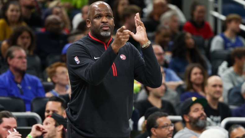 Dec 14, 2022; Orlando, Florida, USA;  Atlanta Hawks head coach Nate McMillan calls a play from the sidelines against the Orlando Magic in the fourth quarter at Amway Center. Mandatory Credit: Nathan Ray Seebeck-USA TODAY Sports