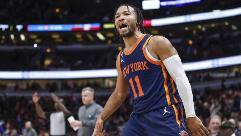 Dec 14, 2022; Chicago, Illinois, USA; New York Knicks guard Jalen Brunson (11) reacts after making a three-pointer against the Chicago Bulls in overtime at United Center. Mandatory Credit: Kamil Krzaczynski-USA TODAY Sports