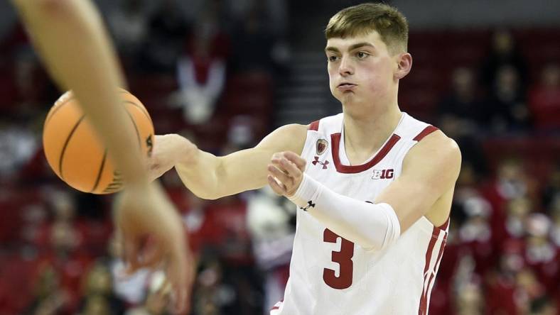 Dec 15, 2022; Madison, Wisconsin, USA;  Wisconsin Badgers guard Connor Essegian (3) passes the ball during the second half against the Lehigh Mountain Hawks at the Kohl Center. Mandatory Credit: Kayla Wolf-USA TODAY Sports