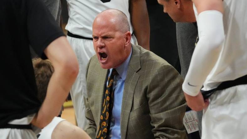 Dec 15, 2022; Boulder, Colorado, USA; Colorado Buffaloes head coach Tad Boyle during a timeout with his player in the first half against the North Alabama Lions at the CU Events Center. Mandatory Credit: Ron Chenoy-USA TODAY Sports