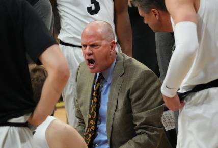 Dec 15, 2022; Boulder, Colorado, USA; Colorado Buffaloes head coach Tad Boyle during a timeout with his player in the first half against the North Alabama Lions at the CU Events Center. Mandatory Credit: Ron Chenoy-USA TODAY Sports