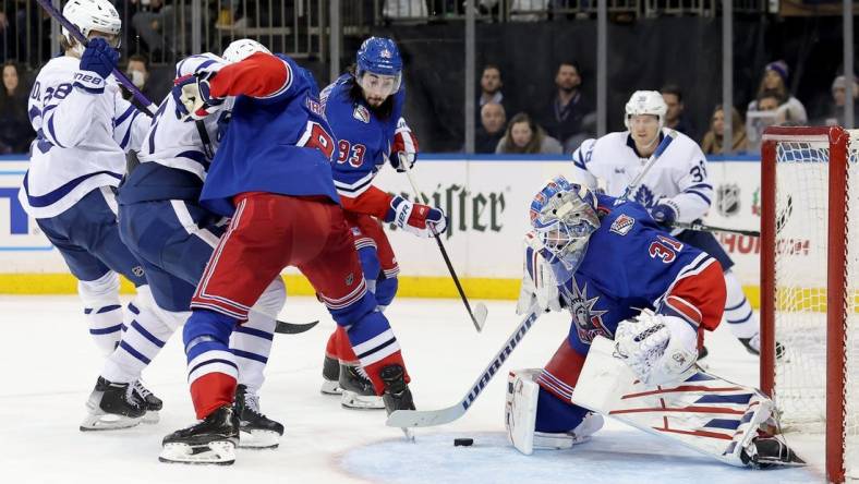 Dec 15, 2022; New York, New York, USA; New York Rangers goaltender Igor Shesterkin (31) plays the puck against the Toronto Maple Leafs during the third period at Madison Square Garden. Mandatory Credit: Brad Penner-USA TODAY Sports