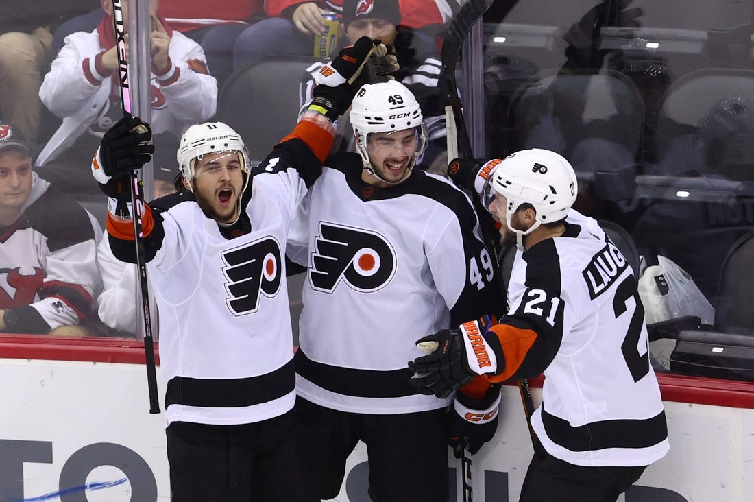 Dec 15, 2022; Newark, New Jersey, USA; Philadelphia Flyers right wing Travis Konecny (11) celebrates his goal against the New Jersey Devils during the third period at Prudential Center. Mandatory Credit: Ed Mulholland-USA TODAY Sports