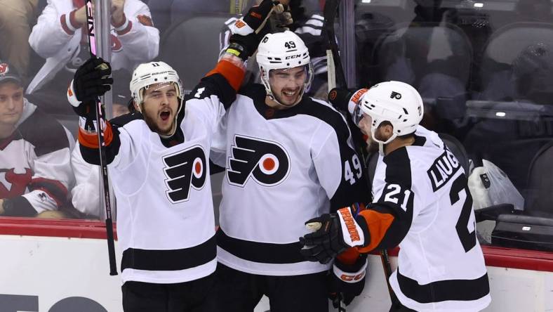 Dec 15, 2022; Newark, New Jersey, USA; Philadelphia Flyers right wing Travis Konecny (11) celebrates his goal against the New Jersey Devils during the third period at Prudential Center. Mandatory Credit: Ed Mulholland-USA TODAY Sports