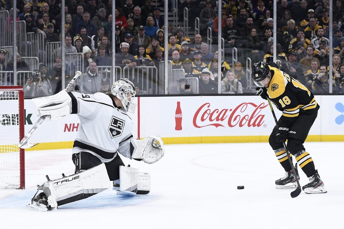 Dec 15, 2022; Boston, Massachusetts, USA;  Boston Bruins center Pavel Zacha (18) looks to gain control of the puck in front of Los Angeles Kings goaltender Pheonix Copley (29) during the third period at TD Garden. Mandatory Credit: Bob DeChiara-USA TODAY Sports