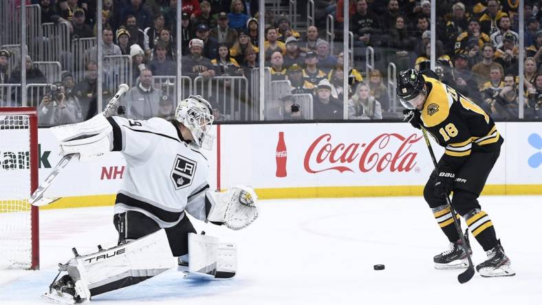 Dec 15, 2022; Boston, Massachusetts, USA;  Boston Bruins center Pavel Zacha (18) looks to gain control of the puck in front of Los Angeles Kings goaltender Pheonix Copley (29) during the third period at TD Garden. Mandatory Credit: Bob DeChiara-USA TODAY Sports