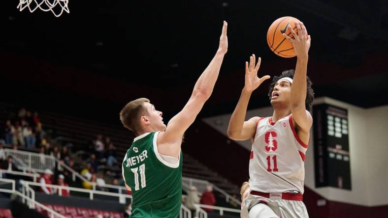 Dec 16, 2022; Stanford, California, USA; Stanford Cardinal guard Ryan Agarwal (11) shoots the basketball against Green Bay Phoenix forward Cade Meyer (11) during the first half at Maples Pavilion. Mandatory Credit: Robert Edwards-USA TODAY Sports