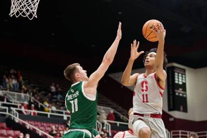 Dec 16, 2022; Stanford, California, USA; Stanford Cardinal guard Ryan Agarwal (11) shoots the basketball against Green Bay Phoenix forward Cade Meyer (11) during the first half at Maples Pavilion. Mandatory Credit: Robert Edwards-USA TODAY Sports