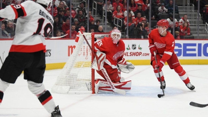 Dec 17, 2022; Detroit, Michigan, USA; Ottaw Sentaors right winger Drake Batherson (19) scores past Detroit Red Wings goalie Ville Husso (35) in the first period at Little Caesars Arena. Mandatory Credit: Lon Horwedel-USA TODAY Sports