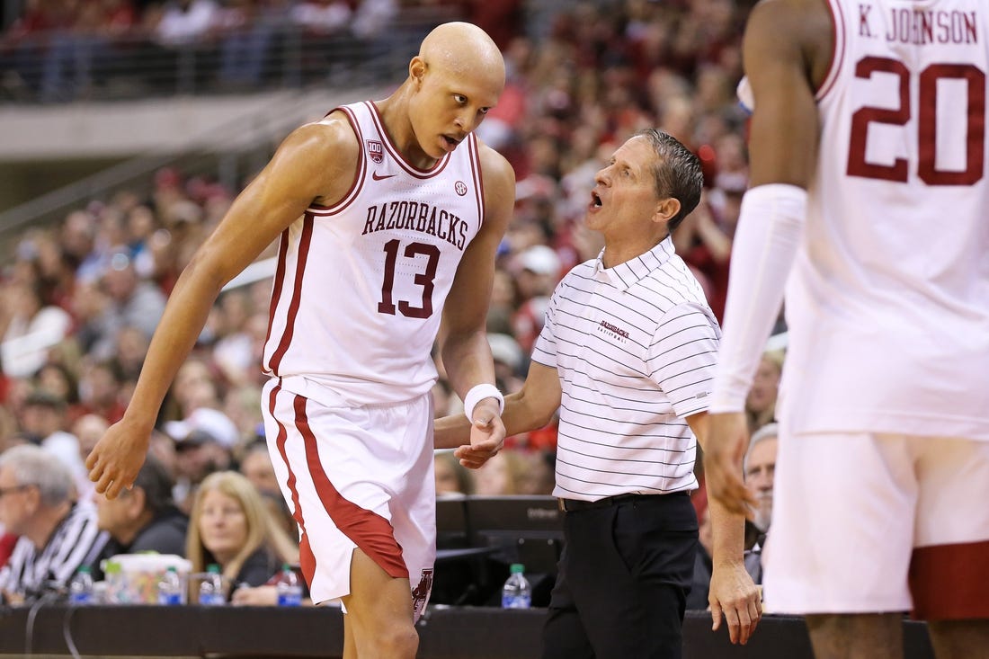 Dec 17, 2022; North Little Rock, Arkansas, USA; Arkansas Razorbacks head coach Eric Musselman talks to guard Jordan Walsh (13) in the first half against the Bradley Braves at Simmons Bank Arena. Mandatory Credit: Nelson Chenault-USA TODAY Sports