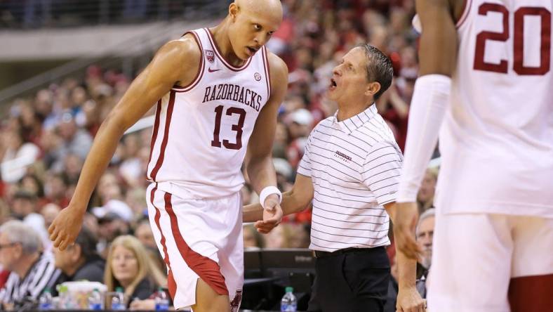 Dec 17, 2022; North Little Rock, Arkansas, USA; Arkansas Razorbacks head coach Eric Musselman talks to guard Jordan Walsh (13) in the first half against the Bradley Braves at Simmons Bank Arena. Mandatory Credit: Nelson Chenault-USA TODAY Sports