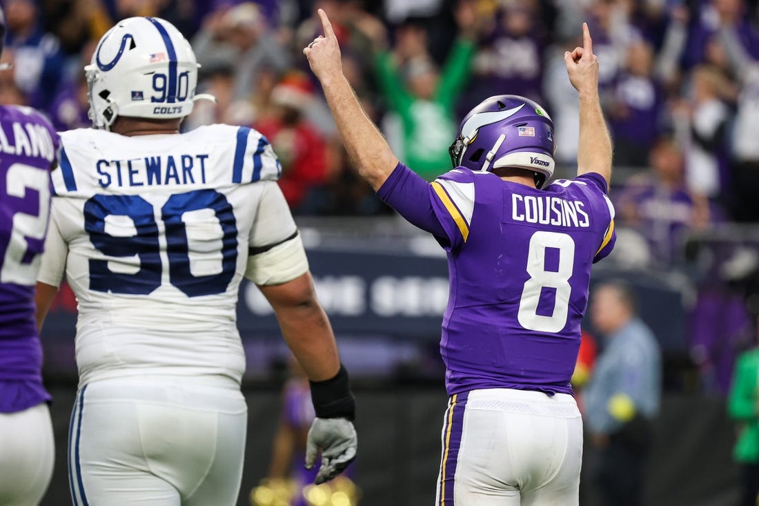 Dec 17, 2022; Minneapolis, Minnesota, USA; Minnesota Vikings quarterback Kirk Cousins (8) celebrates after throwing a touchdown to wide receiver Adam Thielen (not pictured) during the fourth against the Indianapolis Colts quarter at U.S. Bank Stadium. Mandatory Credit: Matt Krohn-USA TODAY Sports