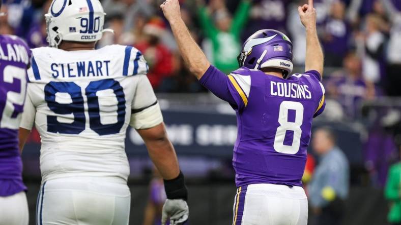 Dec 17, 2022; Minneapolis, Minnesota, USA; Minnesota Vikings quarterback Kirk Cousins (8) celebrates after throwing a touchdown to wide receiver Adam Thielen (not pictured) during the fourth against the Indianapolis Colts quarter at U.S. Bank Stadium. Mandatory Credit: Matt Krohn-USA TODAY Sports