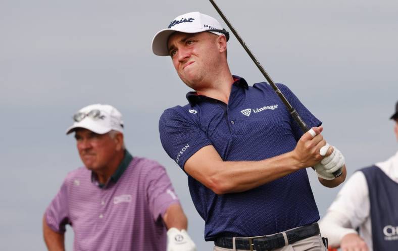 Dec 17, 2022; Orlando, Florida, USA;  Justin Thomas watches his drive on the tenth tee with father Mike Thomas looking on during the first round of the PNC Championship golf tournament at Ritz Carlton Golf Club Grande Lakes Orlando Course. Mandatory Credit: Reinhold Matay-USA TODAY Sports
